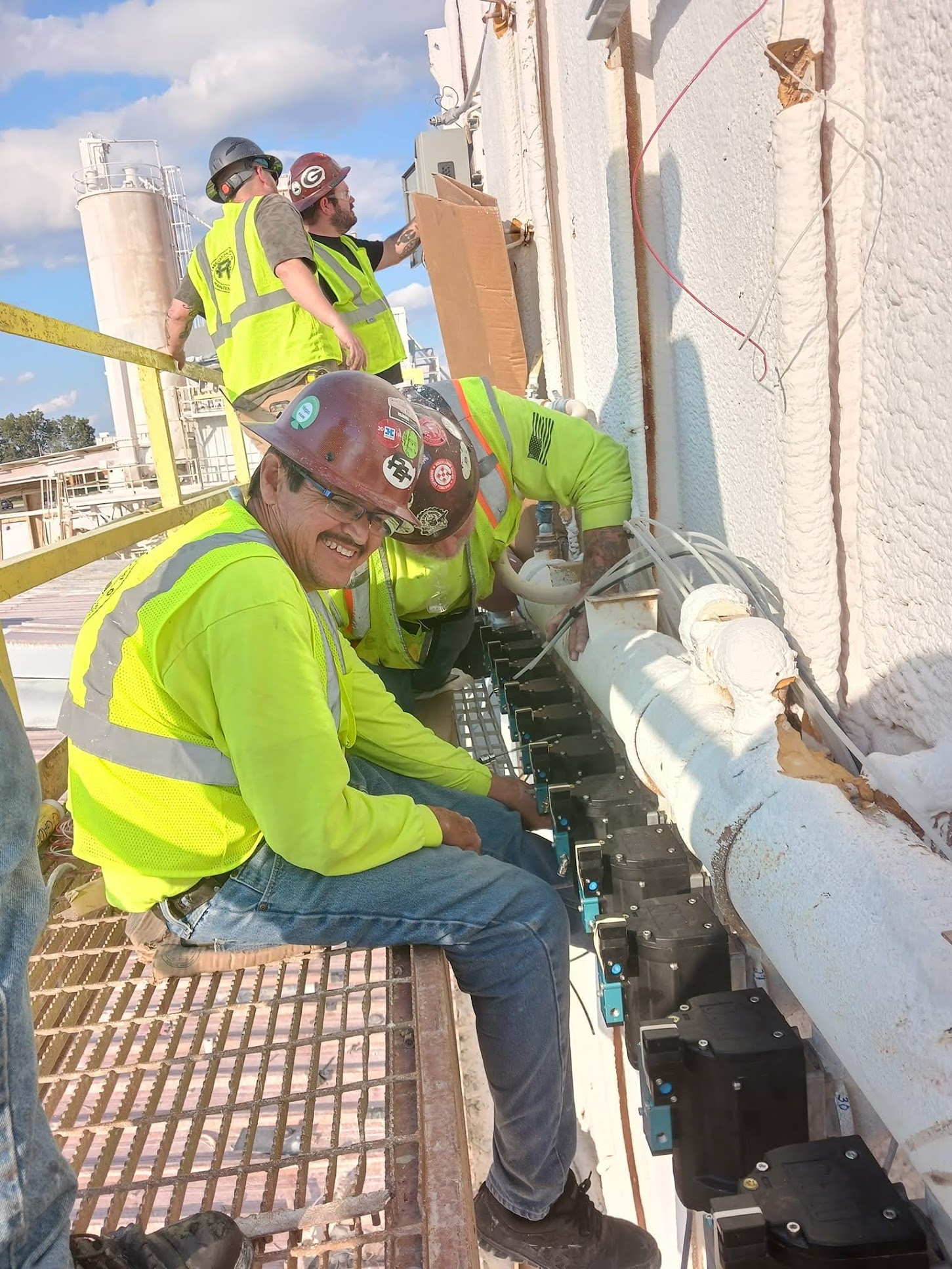 PEC workers in safety gear - structural steel