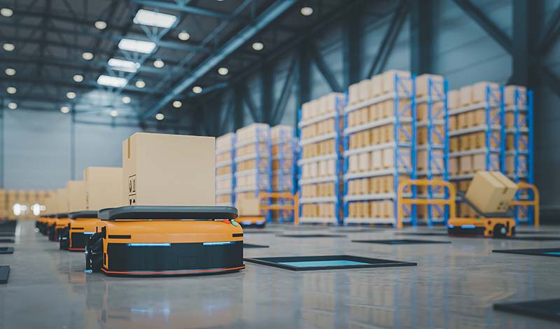 Automated Warehouse Solutions- AMRs Autonomous Mobile Robots moving through a warehosue