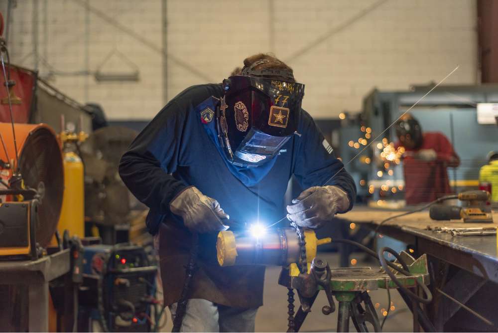 PEC expert welding in an industrial setting