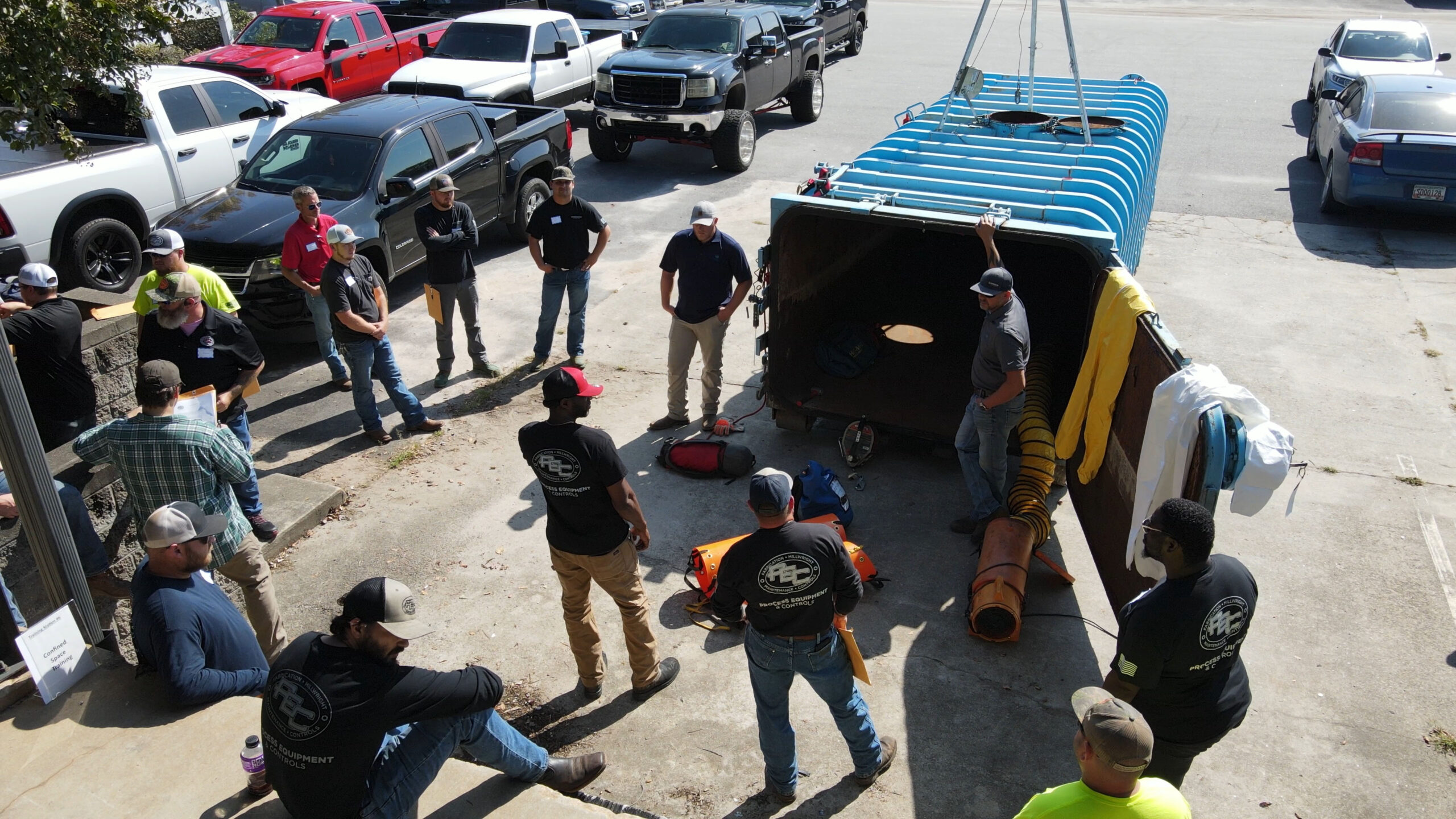 PEC group around blue tank during saftey training