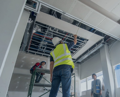 interiors division - PEC employees installing drop ceiling tiles