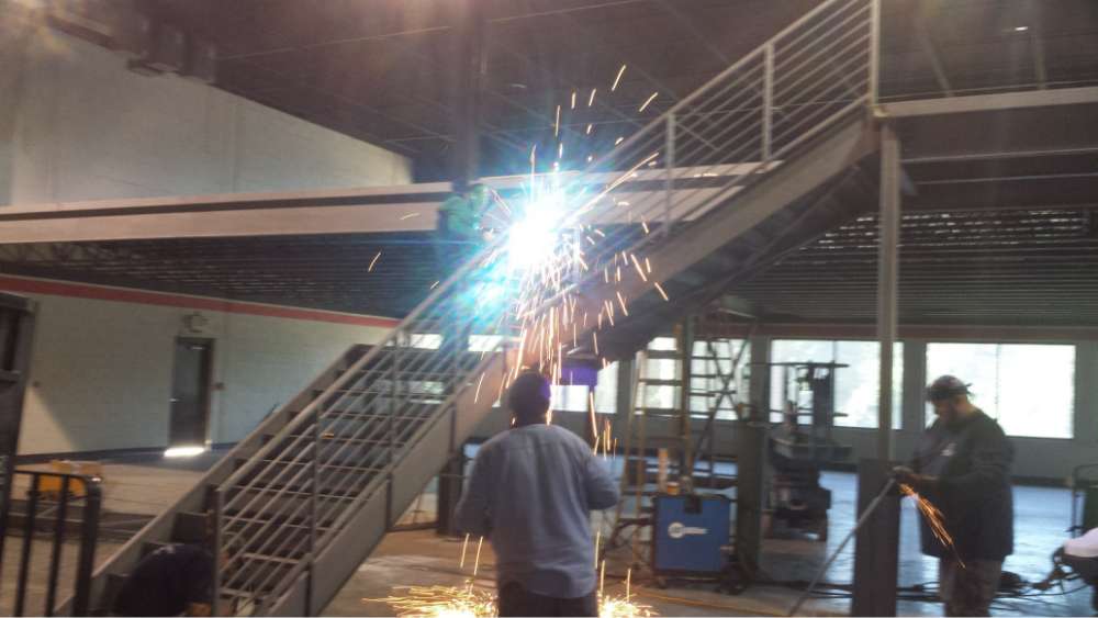 PEC Welder working on Structural Steel Mezzanine